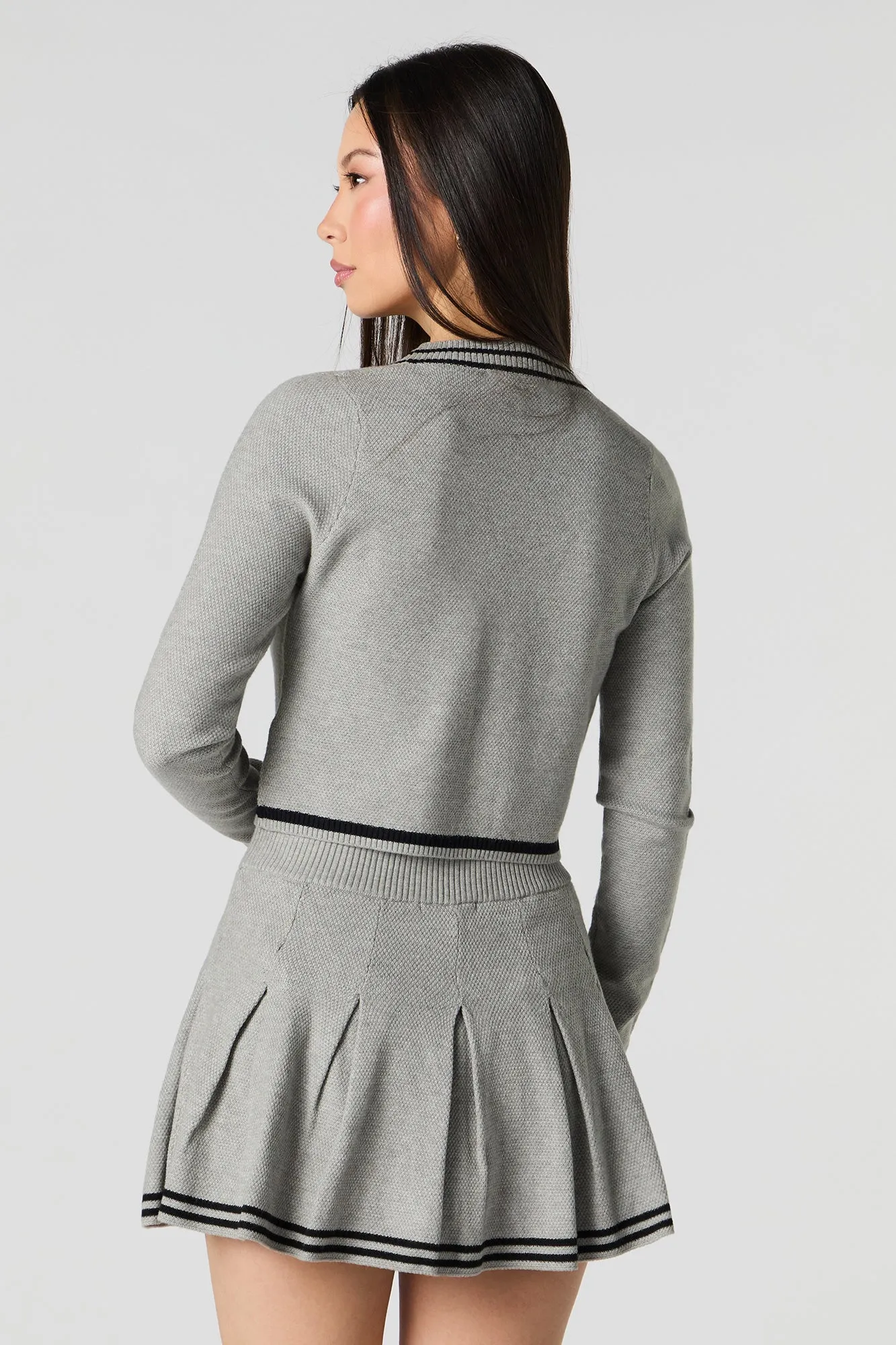 Jupe-short de tennis plissée avec liséré en tricot rayé