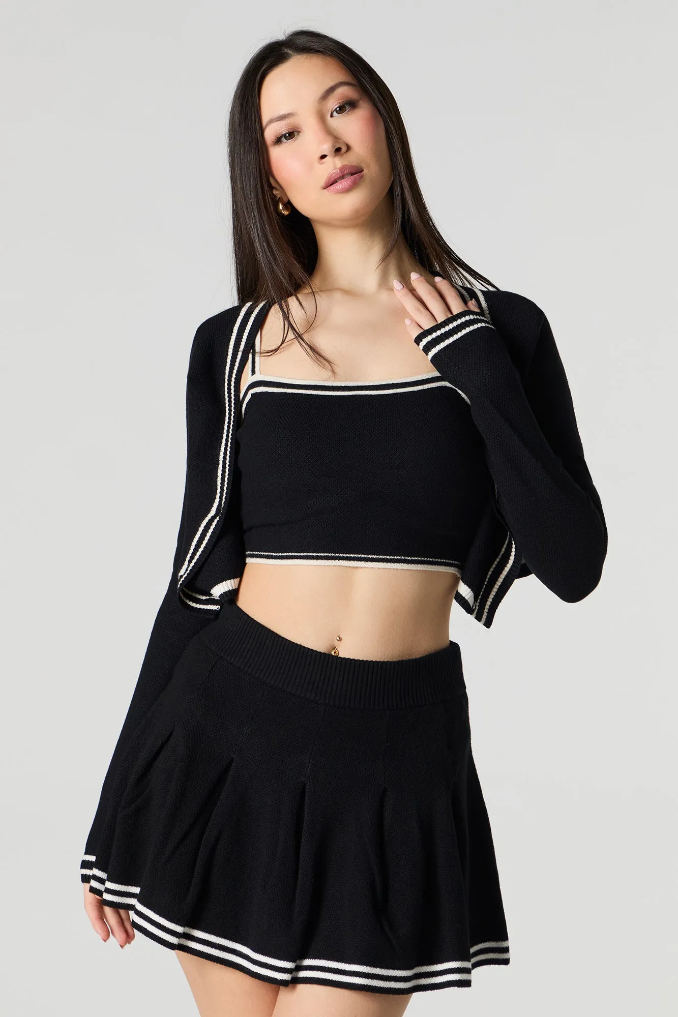 Jupe-short de tennis plissée avec liséré en tricot rayé