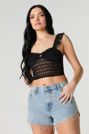 Short en denim avec franges, pierres du Rhin et ourlet arrondi